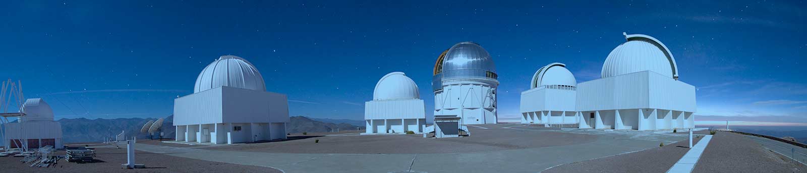 A long-exposure nighttime panorama of Cerro Tololo Inter-American Observatory in Chile CTIO